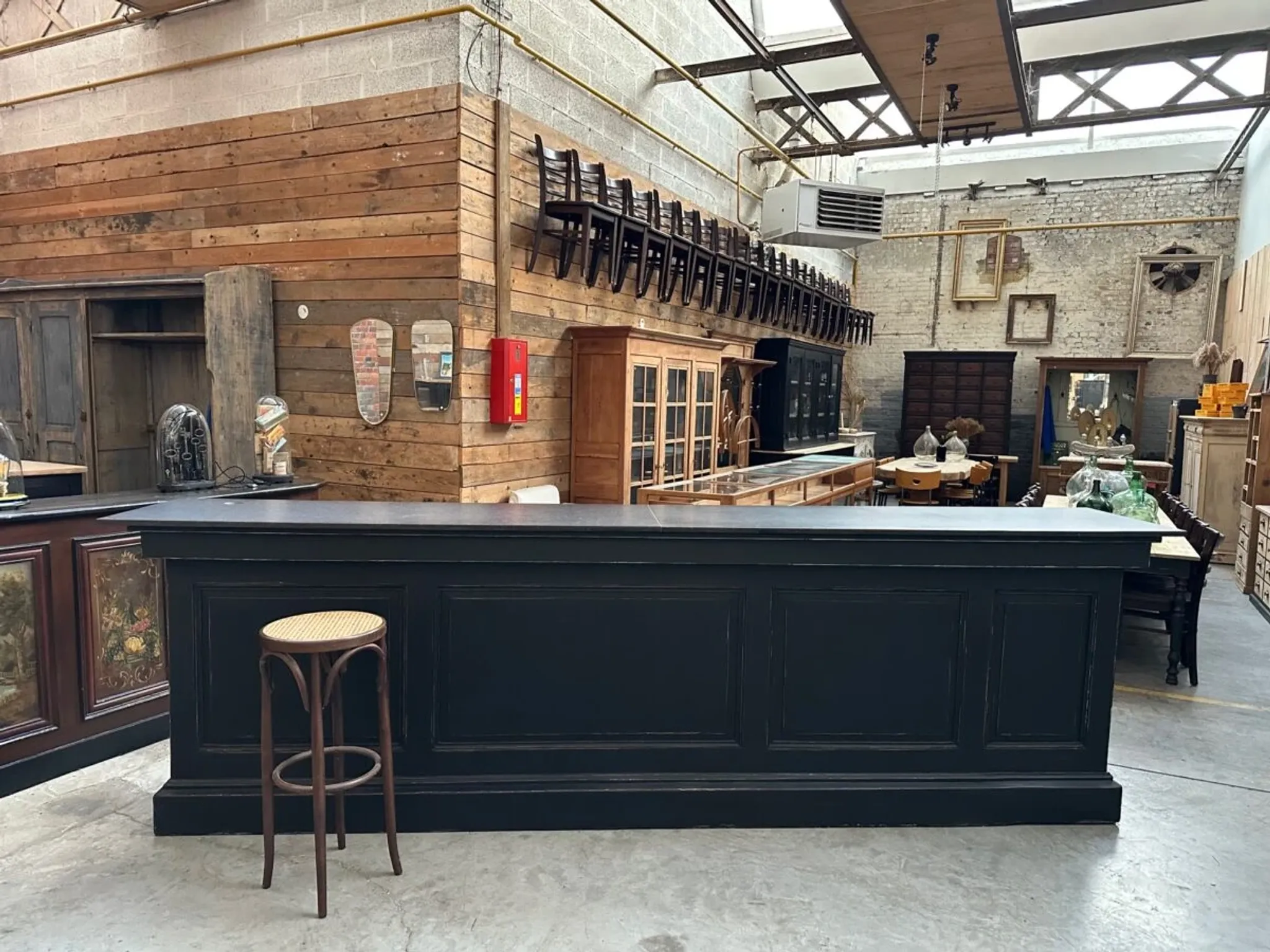 Immense bar counter covered with blue stone.