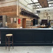 Immense bar counter covered with blue stone.