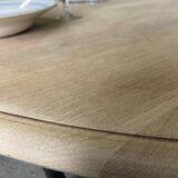Oval table with integrated extension