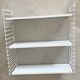 Tomado wall shelves designed by D. Dekker for TOMADO