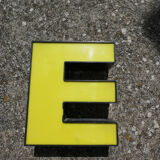 Yellow and black industrial sign letter "E"