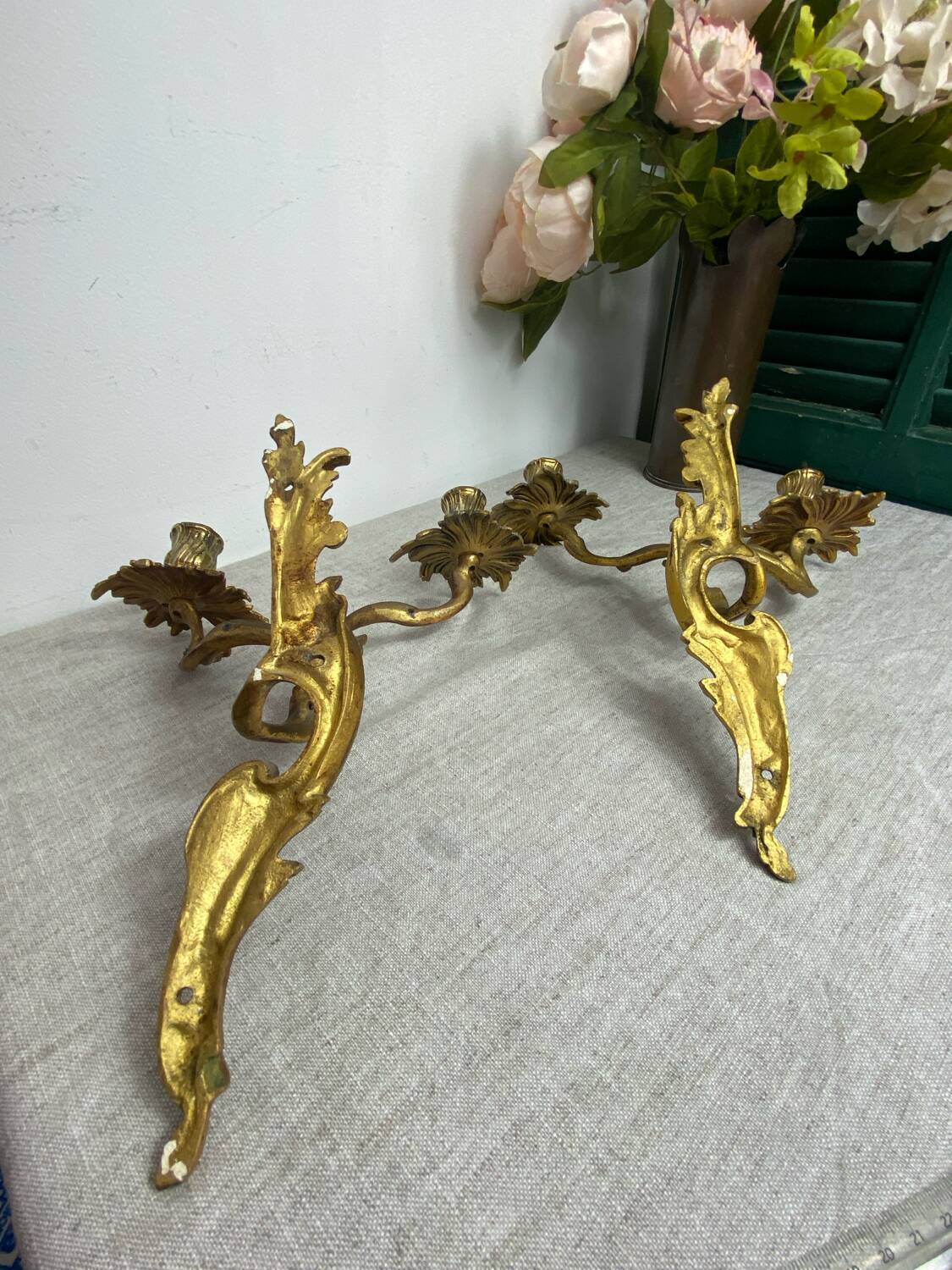 Two Louis XV style bronze wall candlesticks