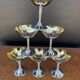 Silver-plated metal wine glasses on stems from the 1970s.