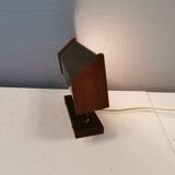 Fuga wall lamp in solid brass and teak wood was designed by Jo Hammerborg for Fog & Mørup in 1966.