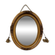 Oval gilt mirror and Art Deco trim