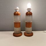Swedish table lamps made of teak wood and hard pressed crystal glass.
