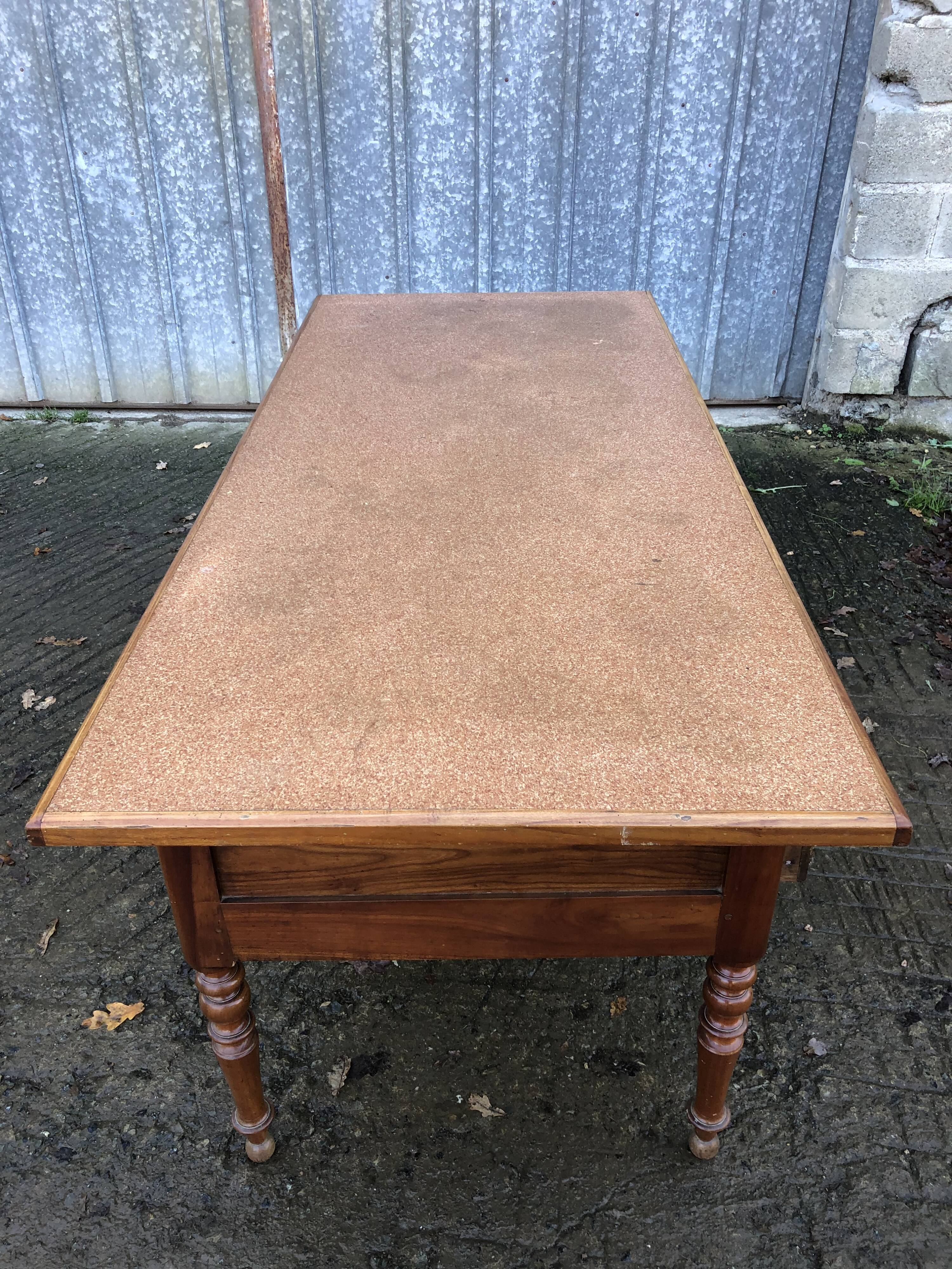 Solid cherry game table with 2 front drawers and panelled crosspieces.