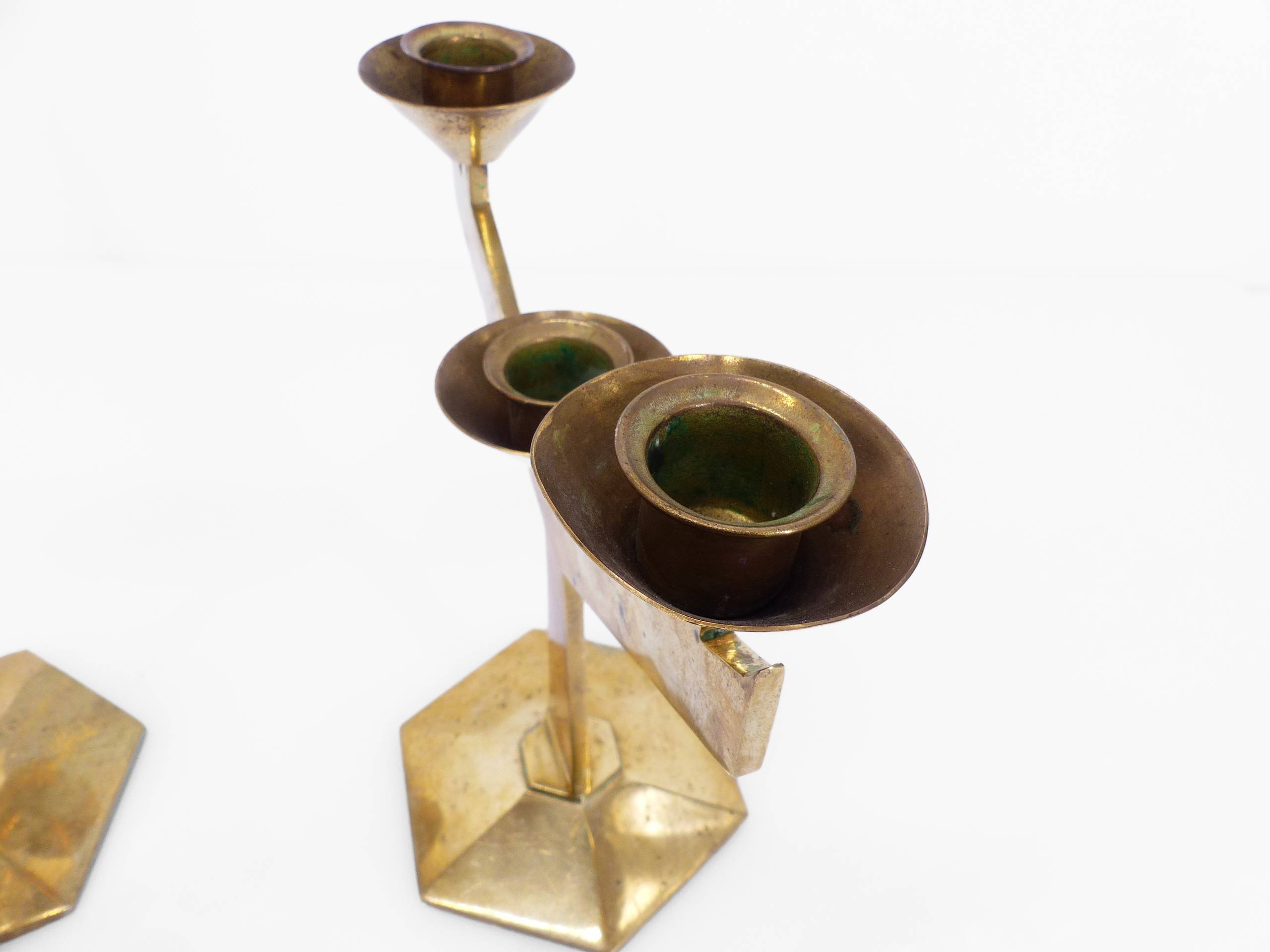 Pair of modernist three-armed solid brass candlesticks, circa 1960