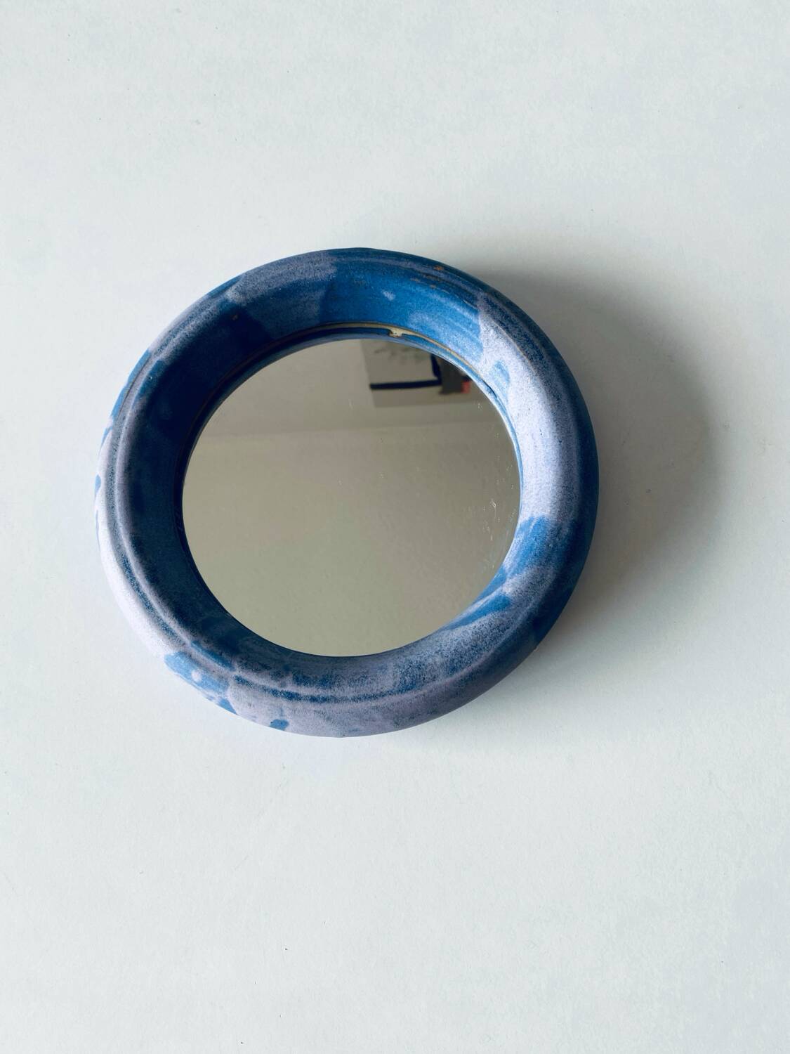 Round ceramic wall mirror
