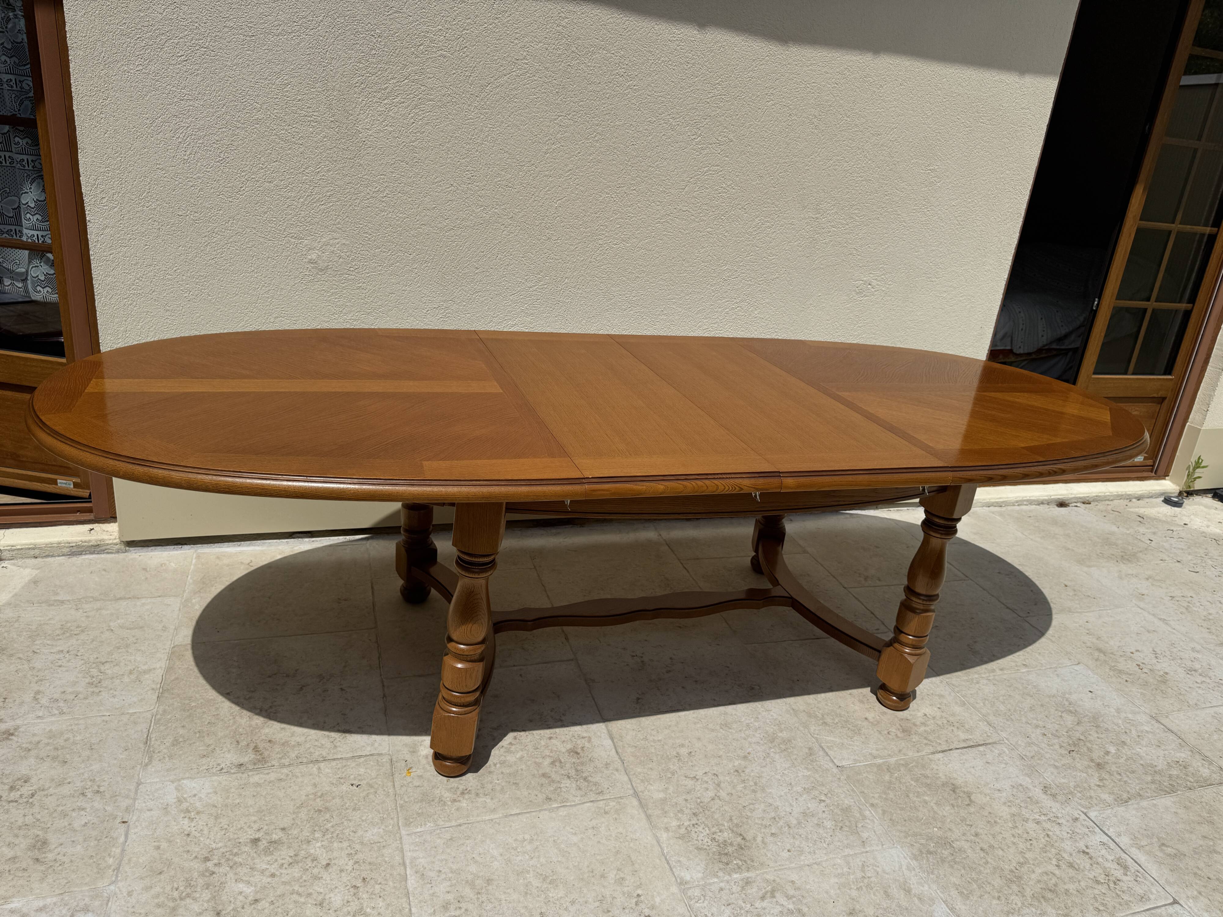 Oak dining table, oval living room table with two extensions.