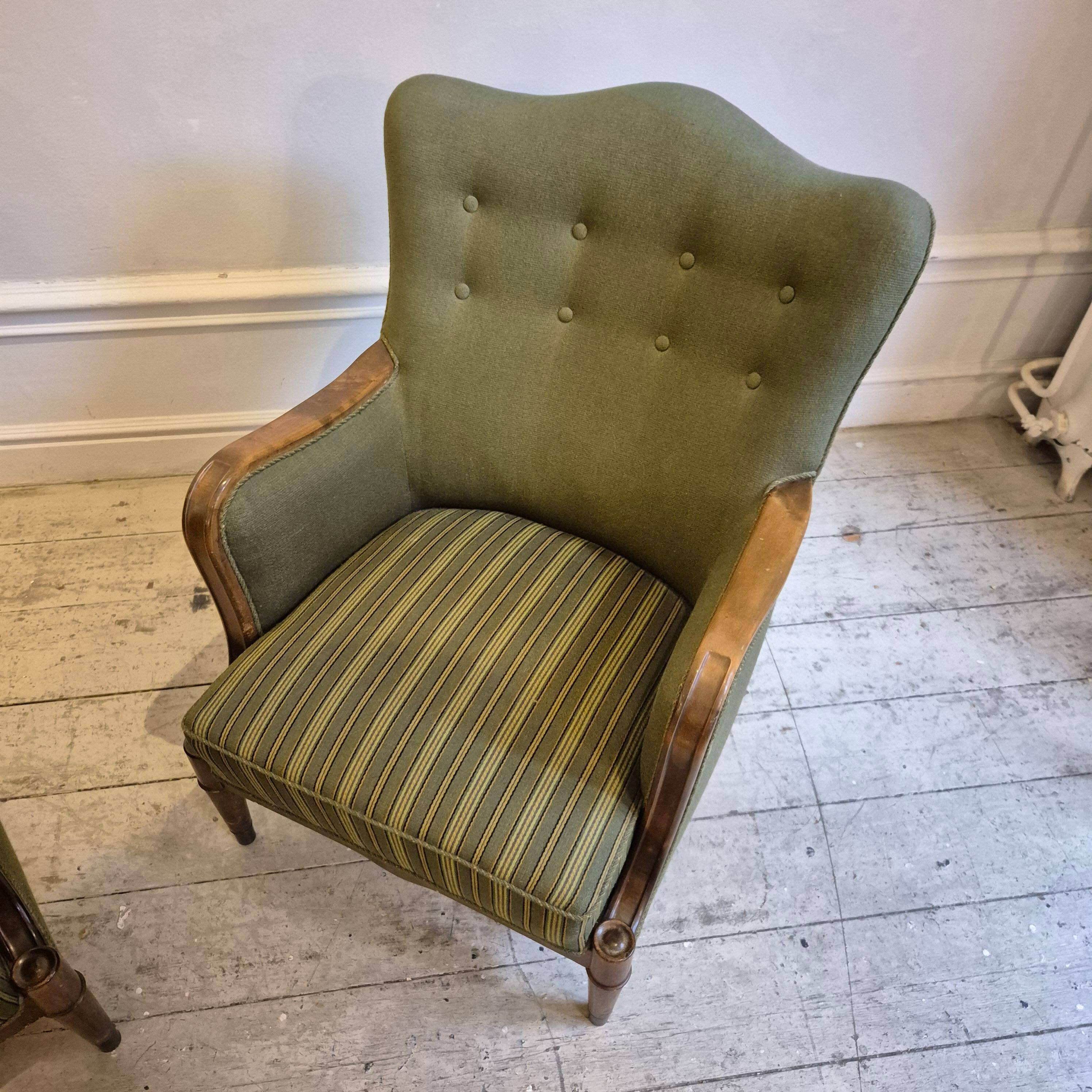 Modern Danish armchairs by Alfred Christensen. Beautiful shape, brass legs.