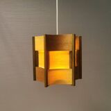 Older lamp in wood veneer, partially painted in green colour.