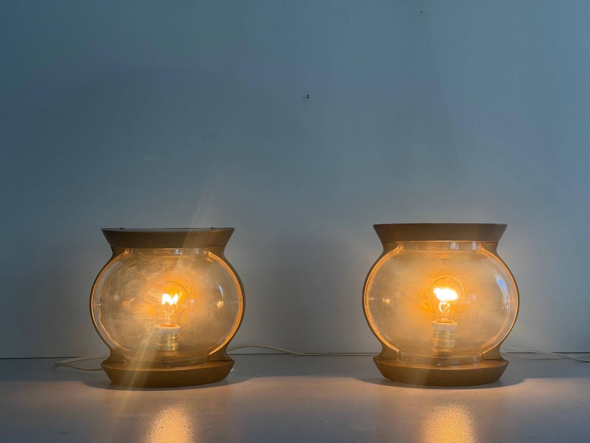 Pair of bronze and glass wall lights from the mid-century, 1960, Italy.