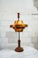 Table lamp with a wooden structure and adjustable copper shade by Stilnovo, 1950s.