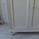 Small vintage piece of furniture sublimated in a linen shade, wooden top.