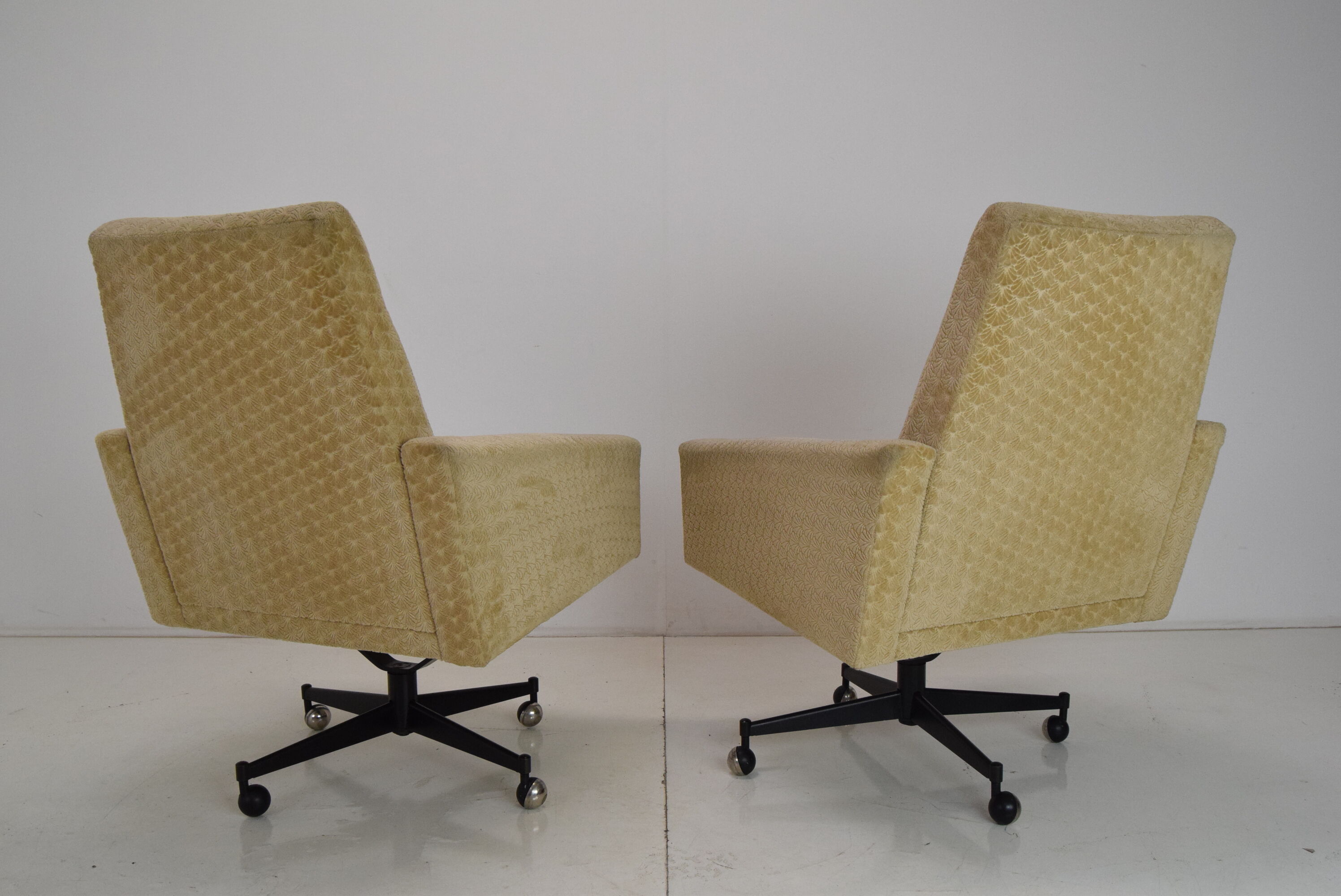 Pair of mid-century swivel armchairs with wheels 1970's