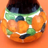 1940s Polychrome ceramic vase decorated with fruit and foliage