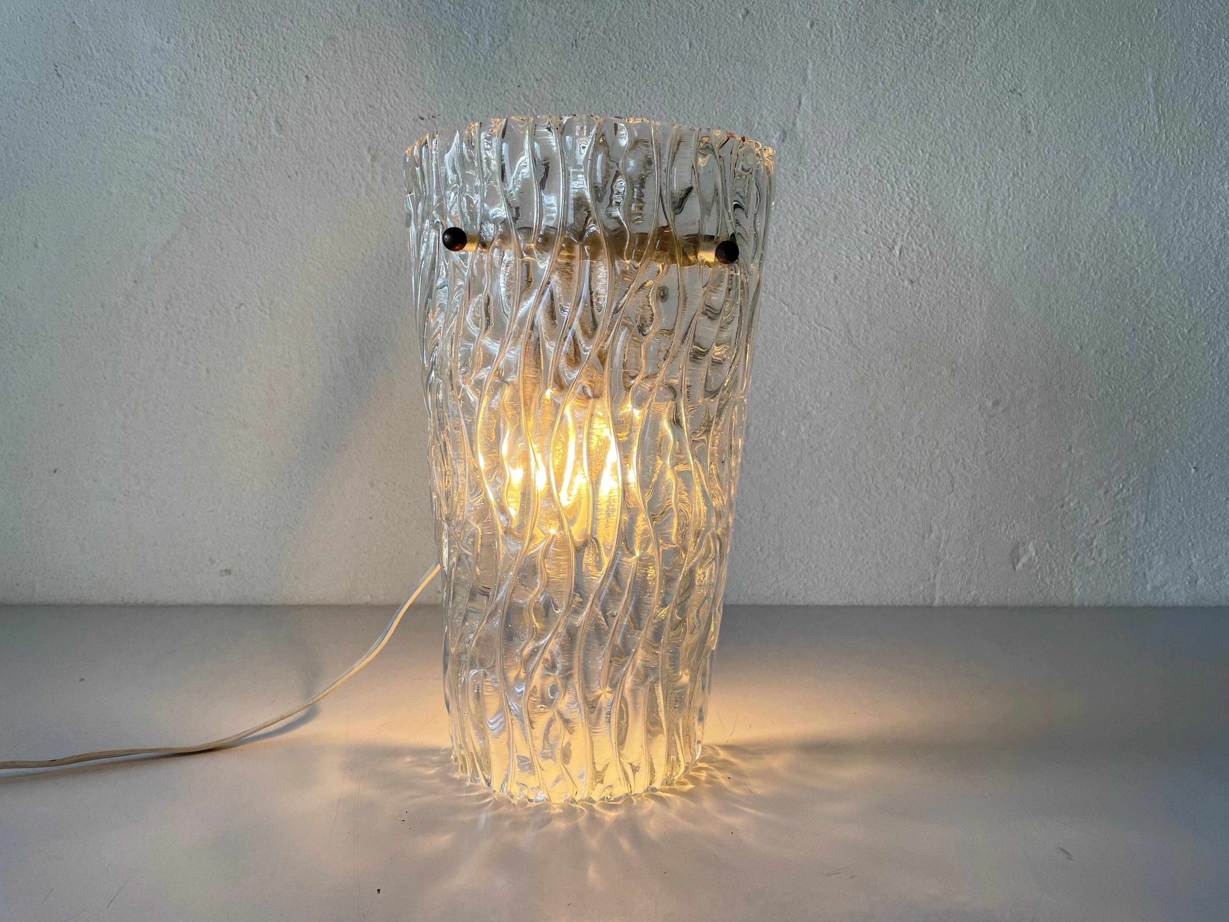 Simple arch-shaped wall light in textured glass, 1950s, Germany.