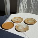 Set of 4 vintage stoneware plates, including 2 with floral motifs