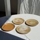 Set of 4 vintage stoneware plates, including 2 with floral motifs