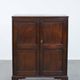 Charming and timeless antique English oak cabinet/commode from the early 19th century with two doors and a working lock