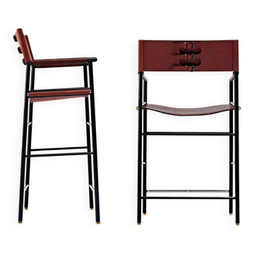 Pair of bar stools with cognac leather backrest and metal frame.