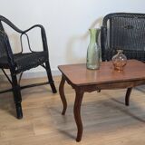 Paire de fauteuils noirs en rotin