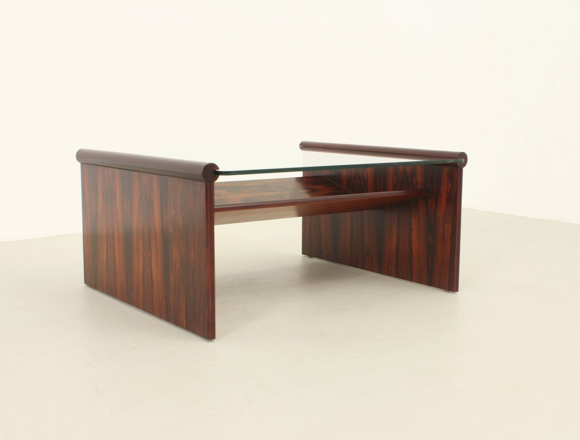Italian coffee table in rosewood with magazine rack, 1960s.