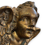 Pair of angel head wall sconces in gilded composition