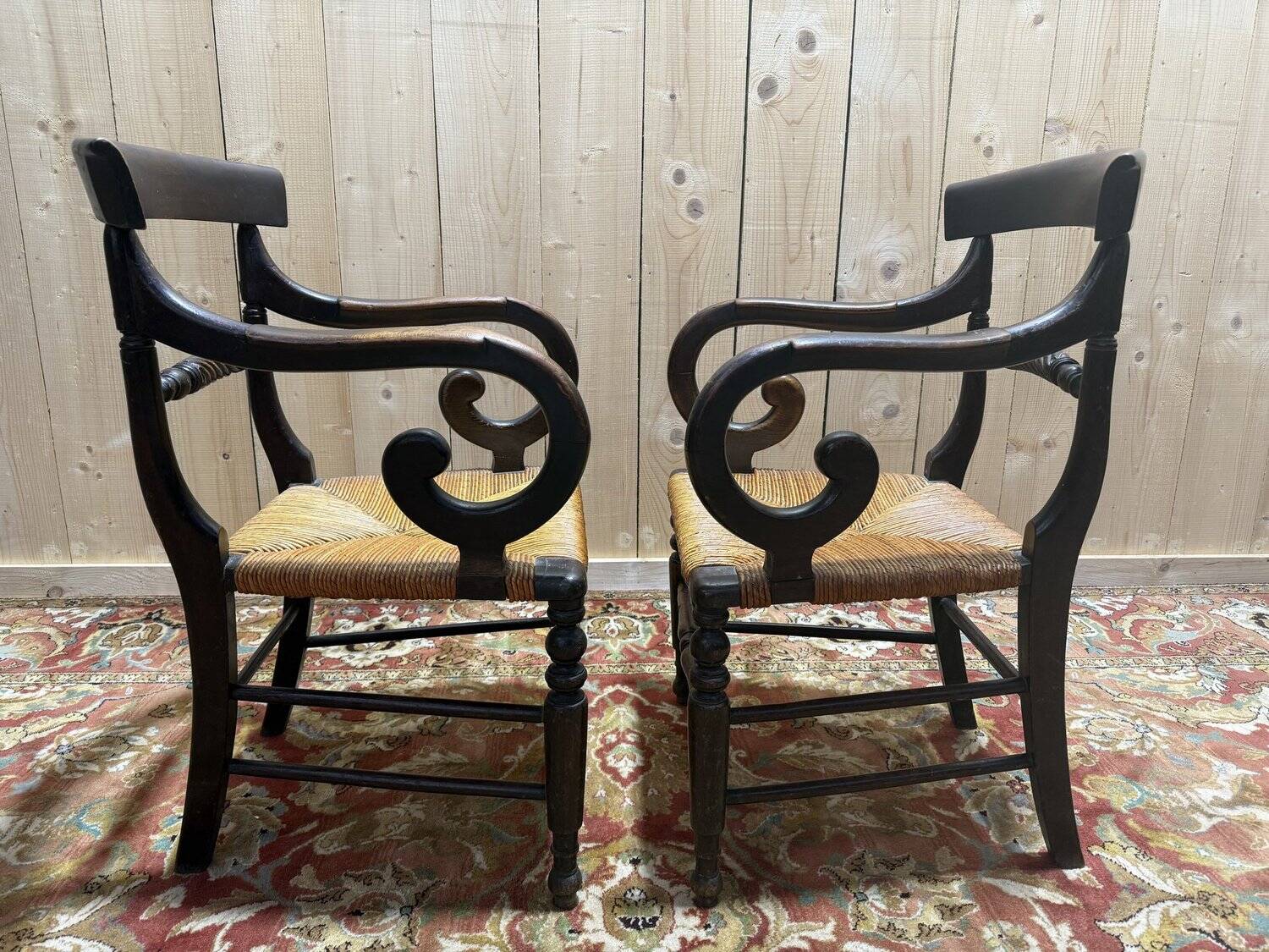 Pair of rustic straw-seated armchairs