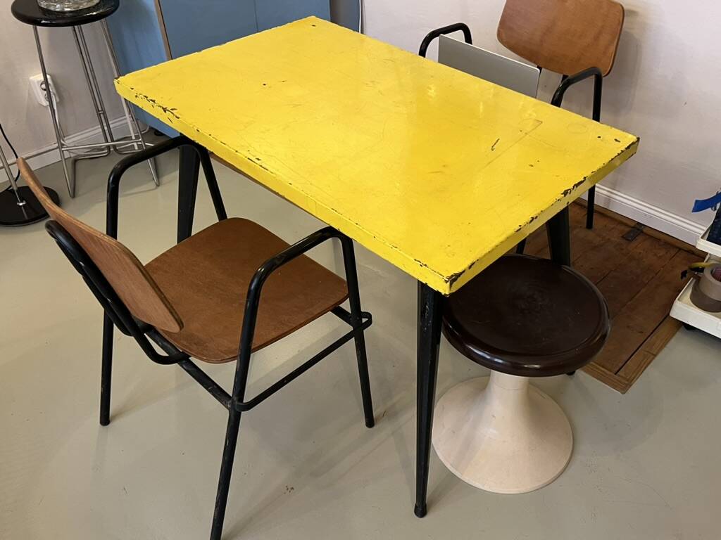 Table in the style of patinated yellow metal Tolix.