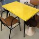 Table in the style of patinated yellow metal Tolix.