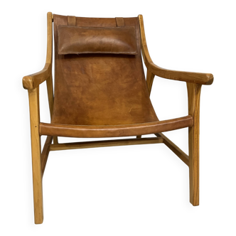 Colonial armchair in leather and wood