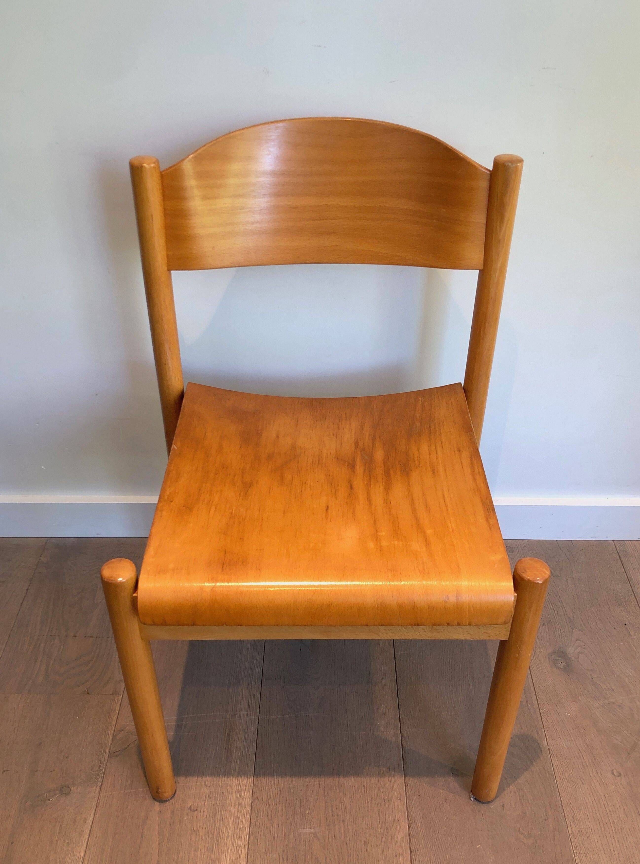 Set of 6 stackable chairs in fir wood.
