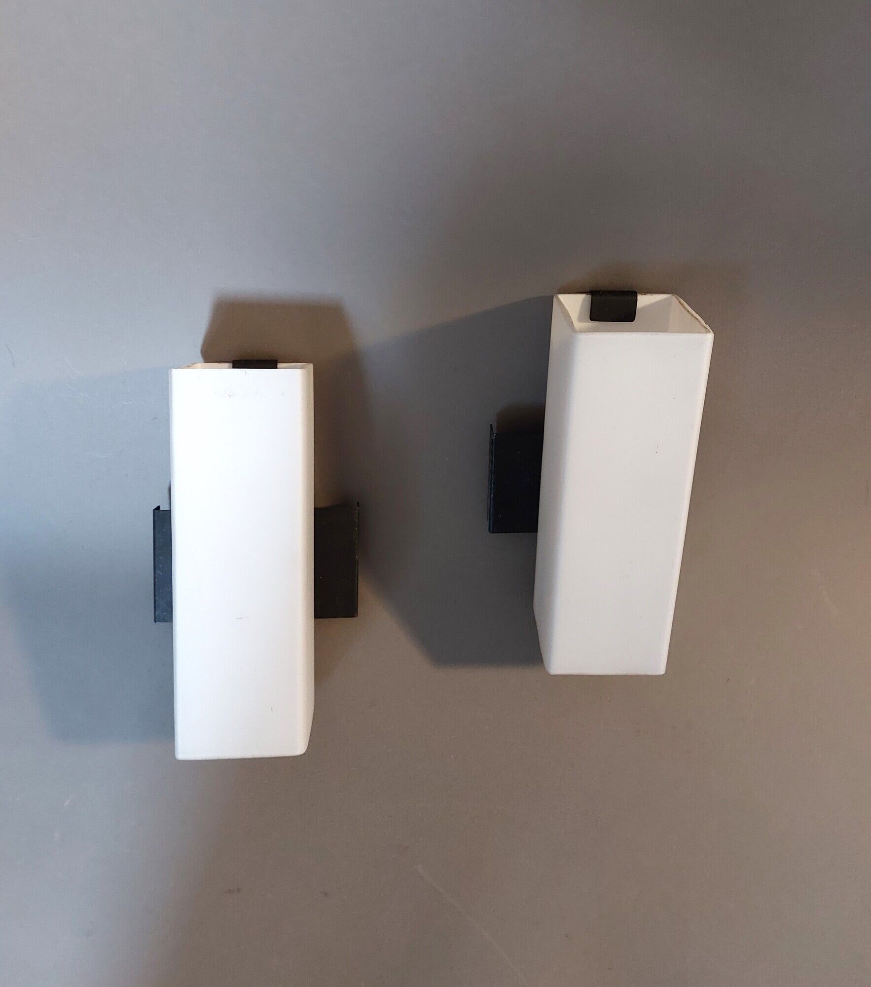 Pair of modernist sconces in black metal and white opaline vintage