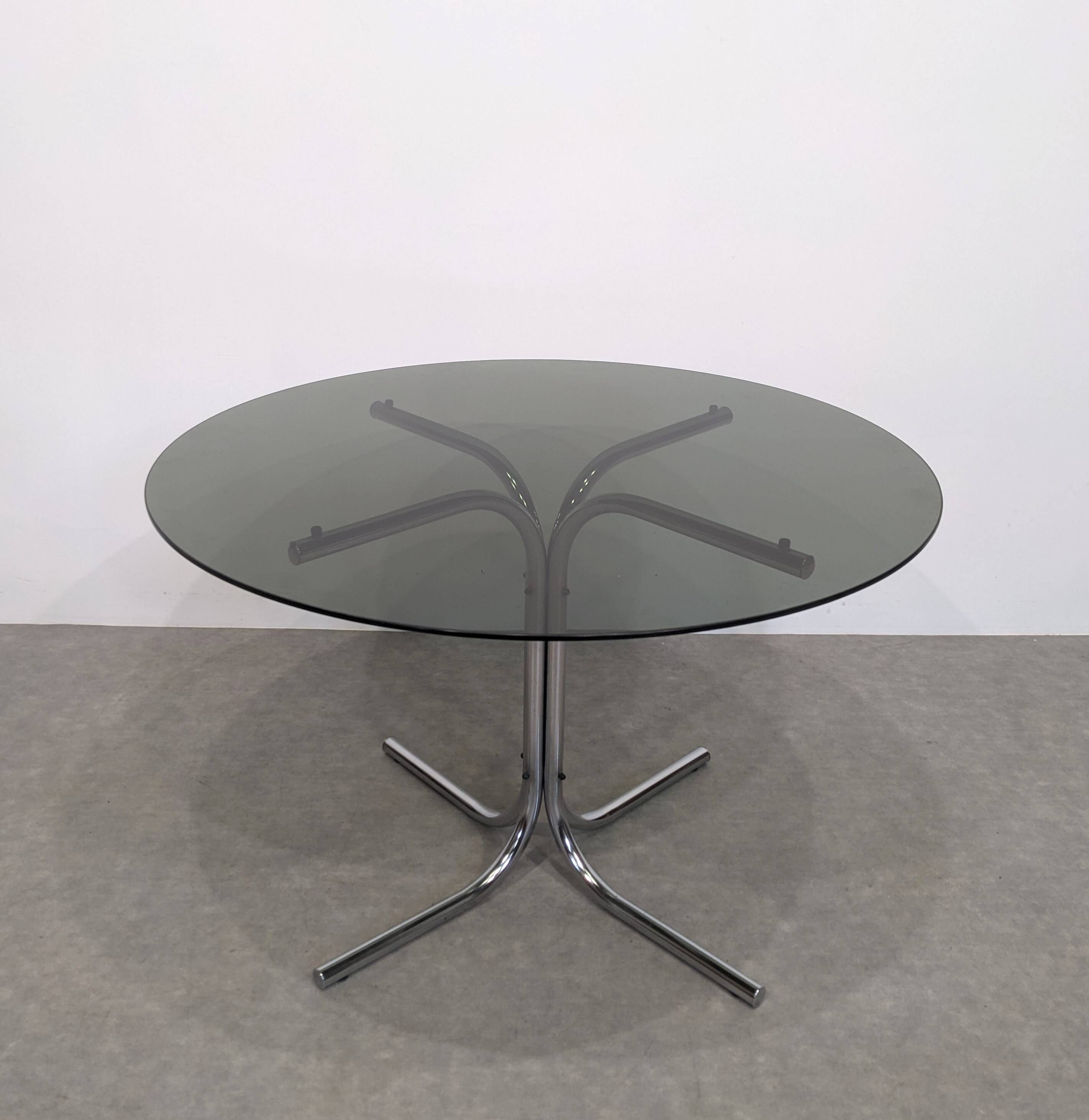 70s round table with smoked glass and chrome