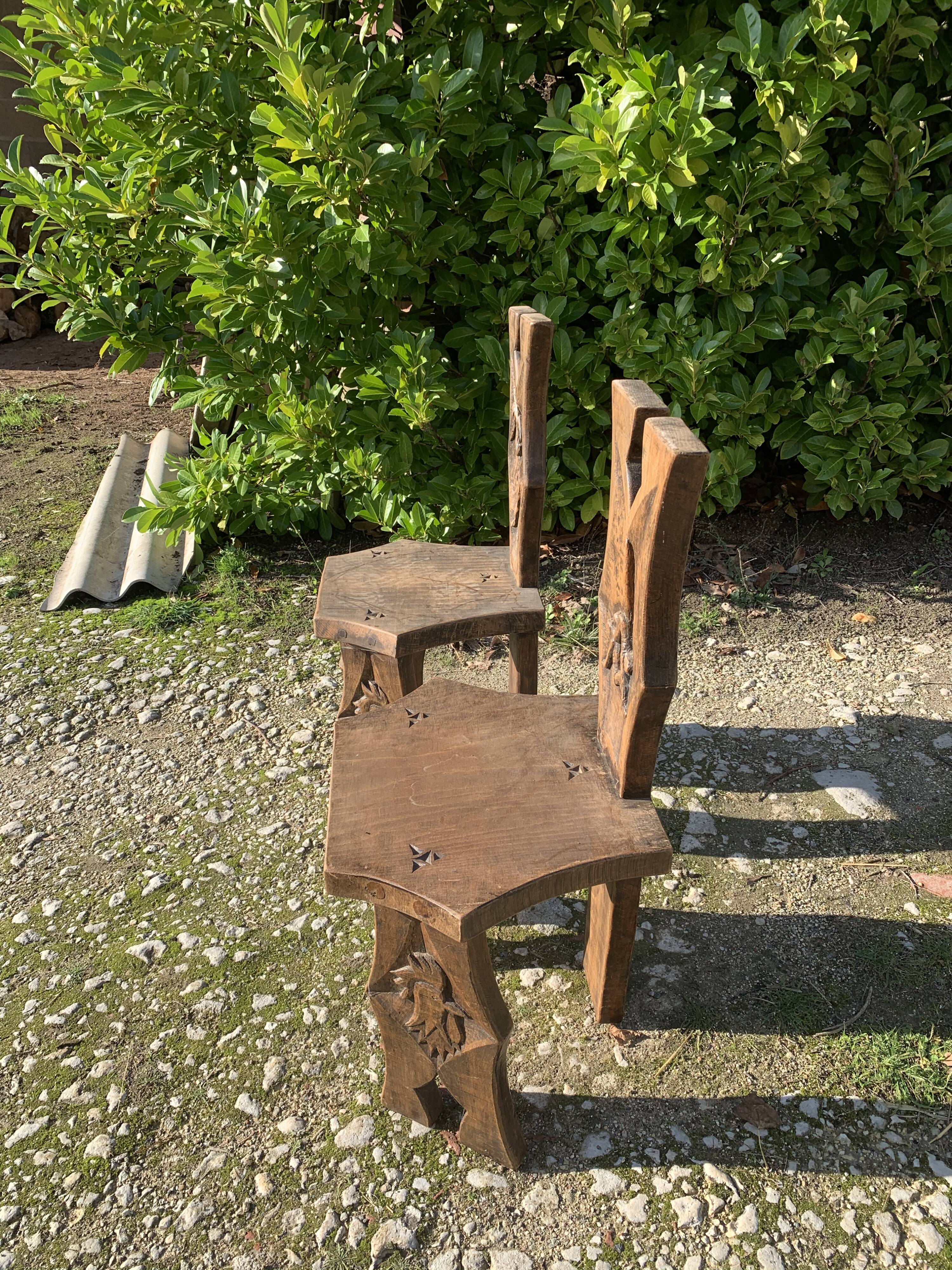2 solid wood Johnny Ludecher folk art chairs
