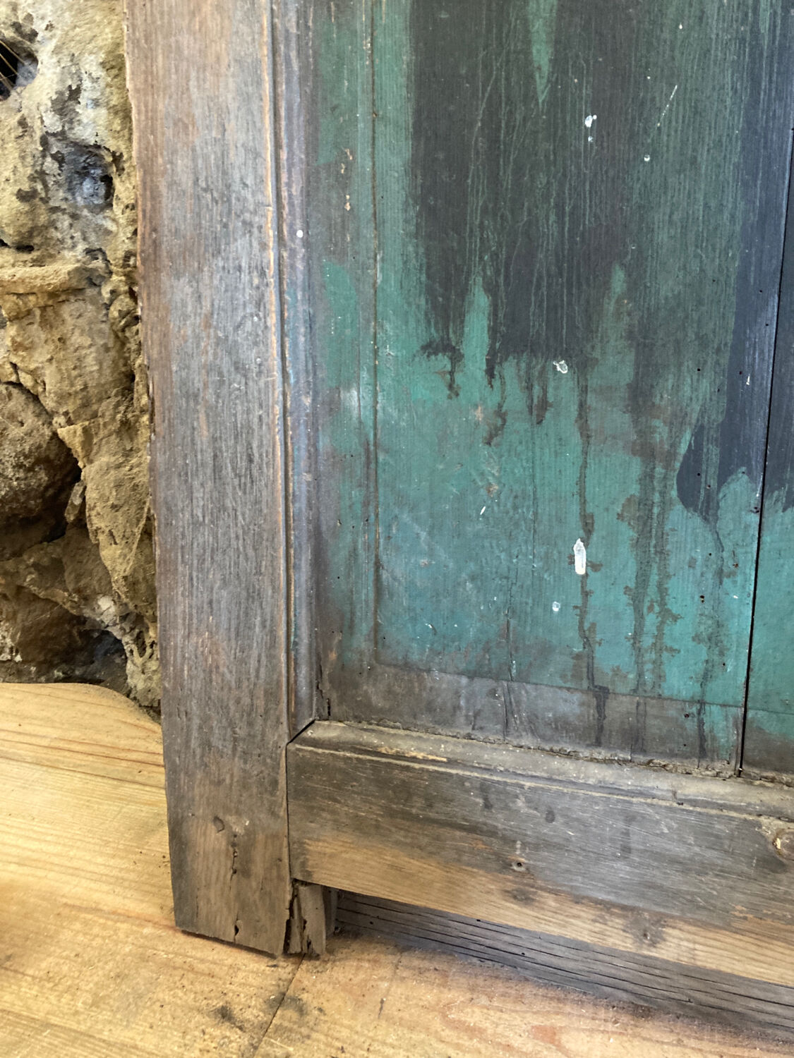 Old glazed wooden door patinated