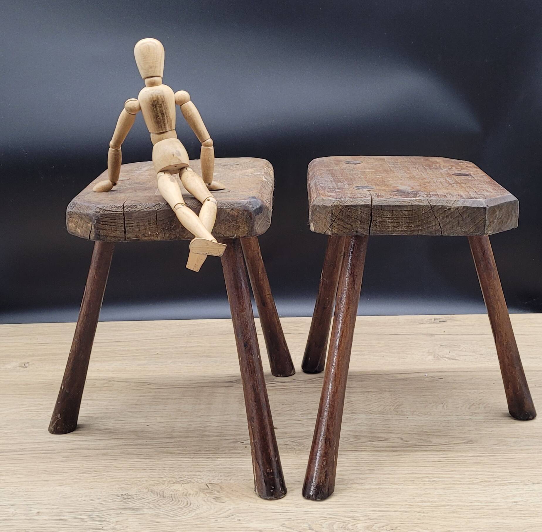 Pair of solid octagon cowhide tripod stools