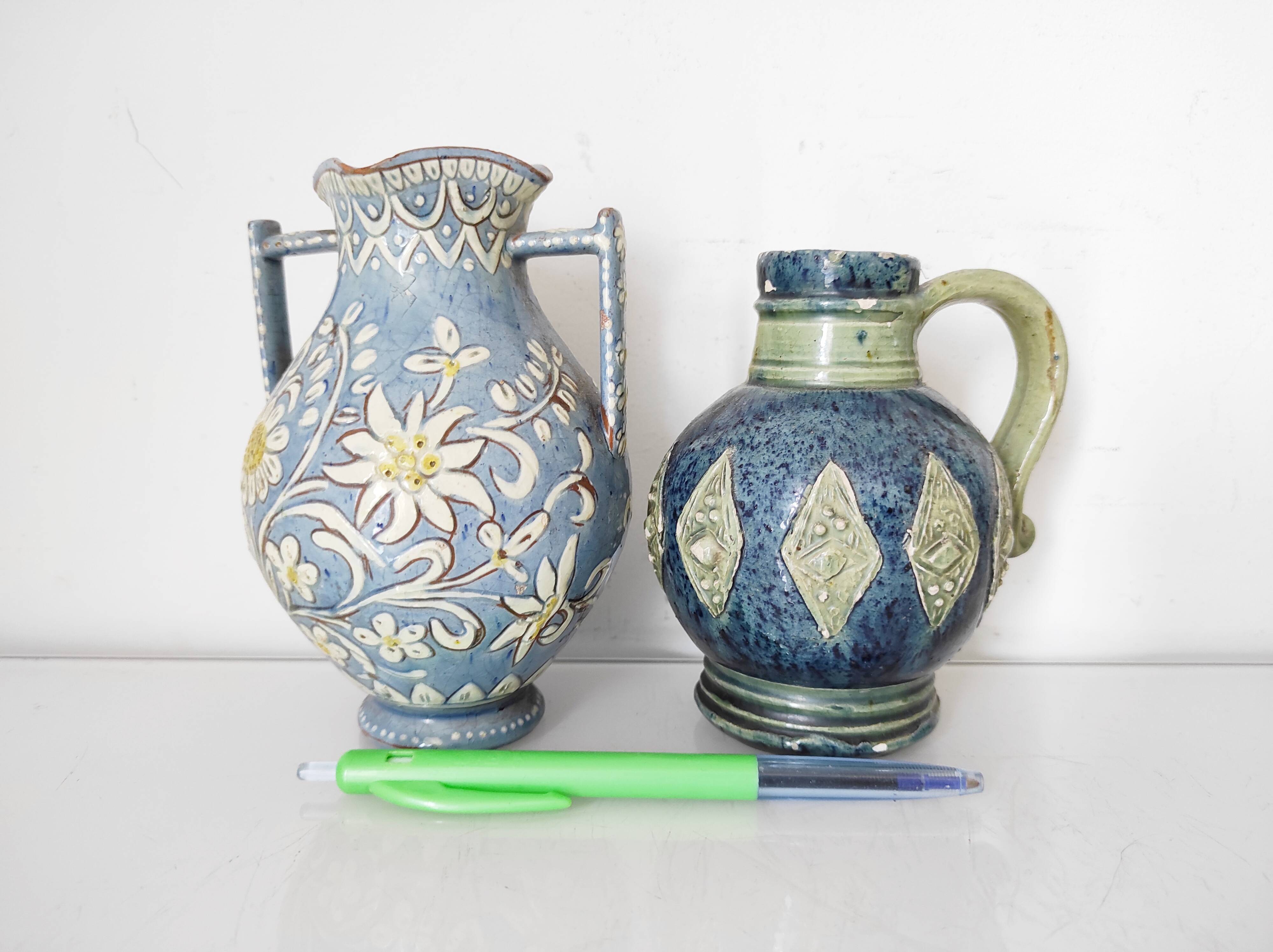 Two small blue ceramic vases