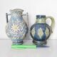 Two small blue ceramic vases