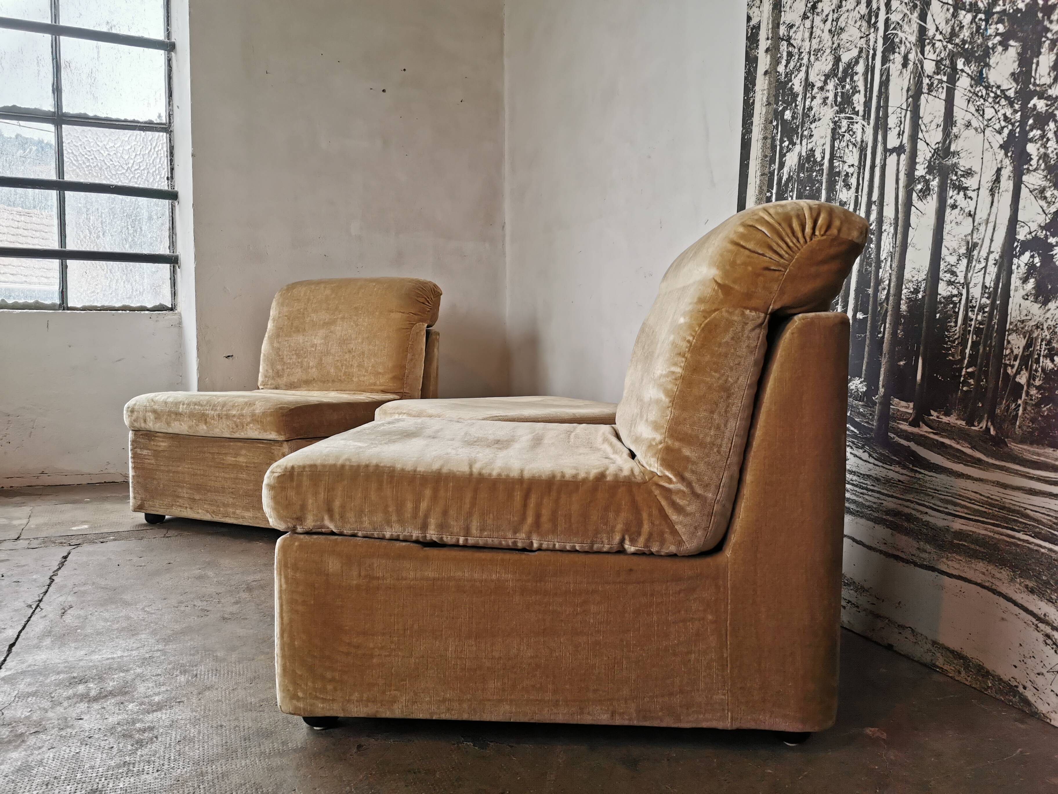Pair of modular velvet armchairs and ottoman