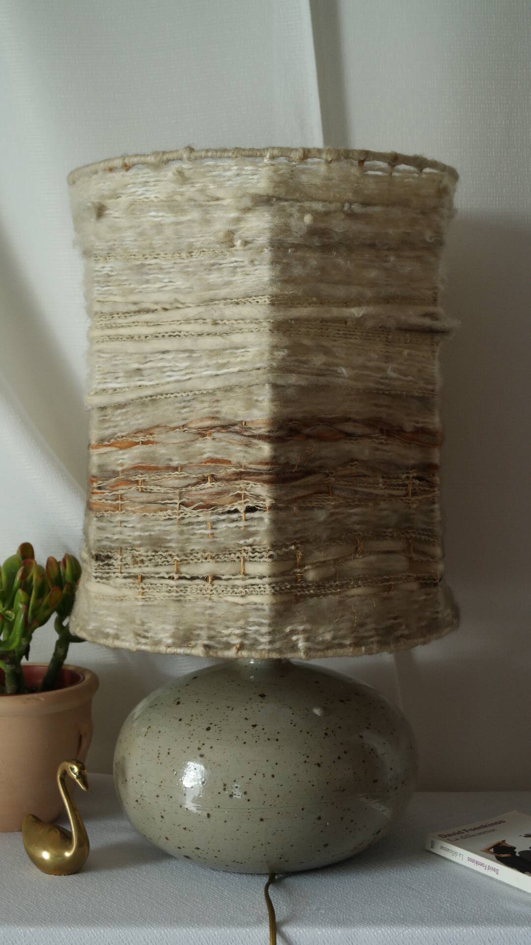 Vintage ceramic lamp with a wool shade.