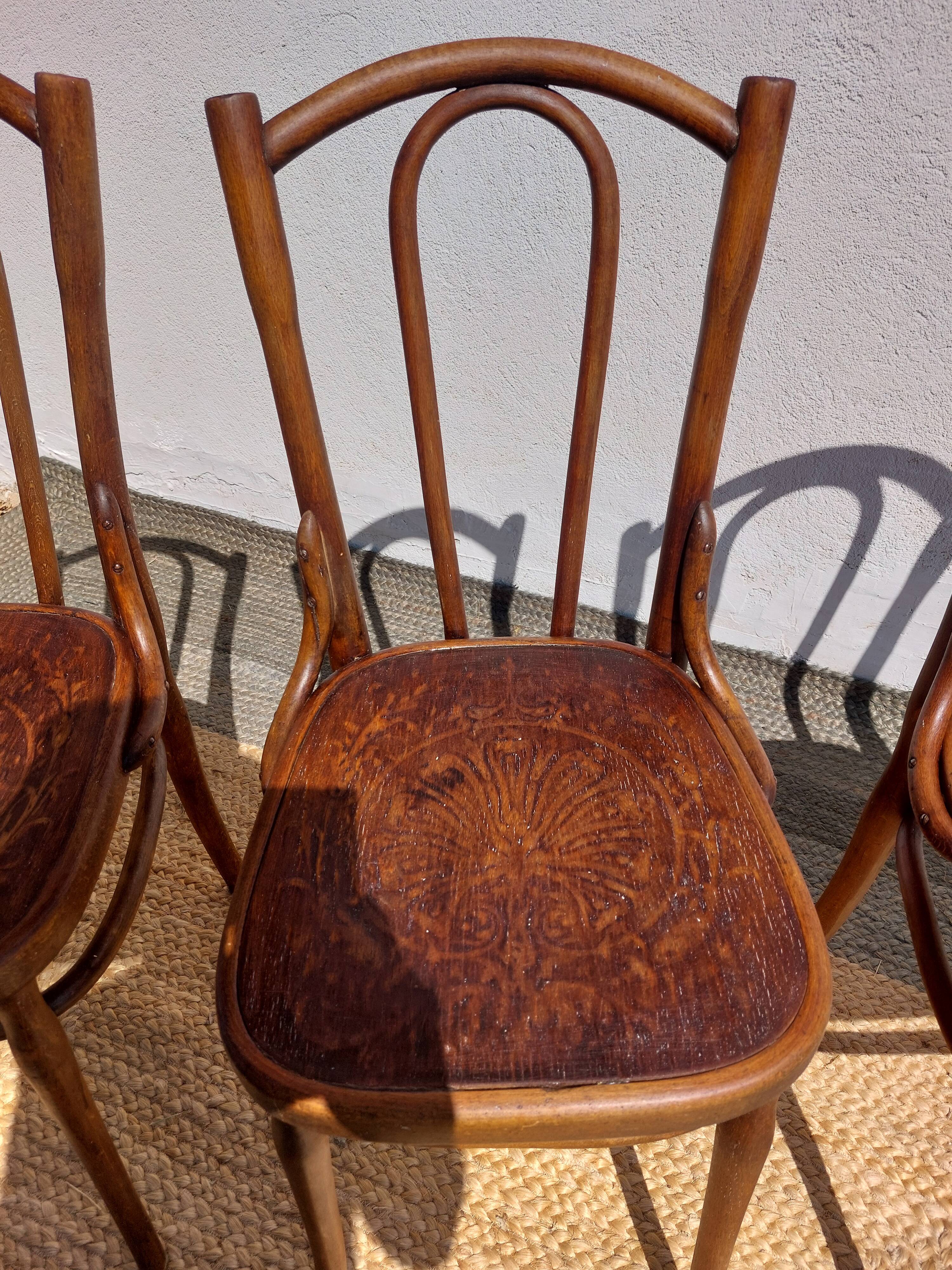 set of 3 curved wooden bistro chairs with patterns