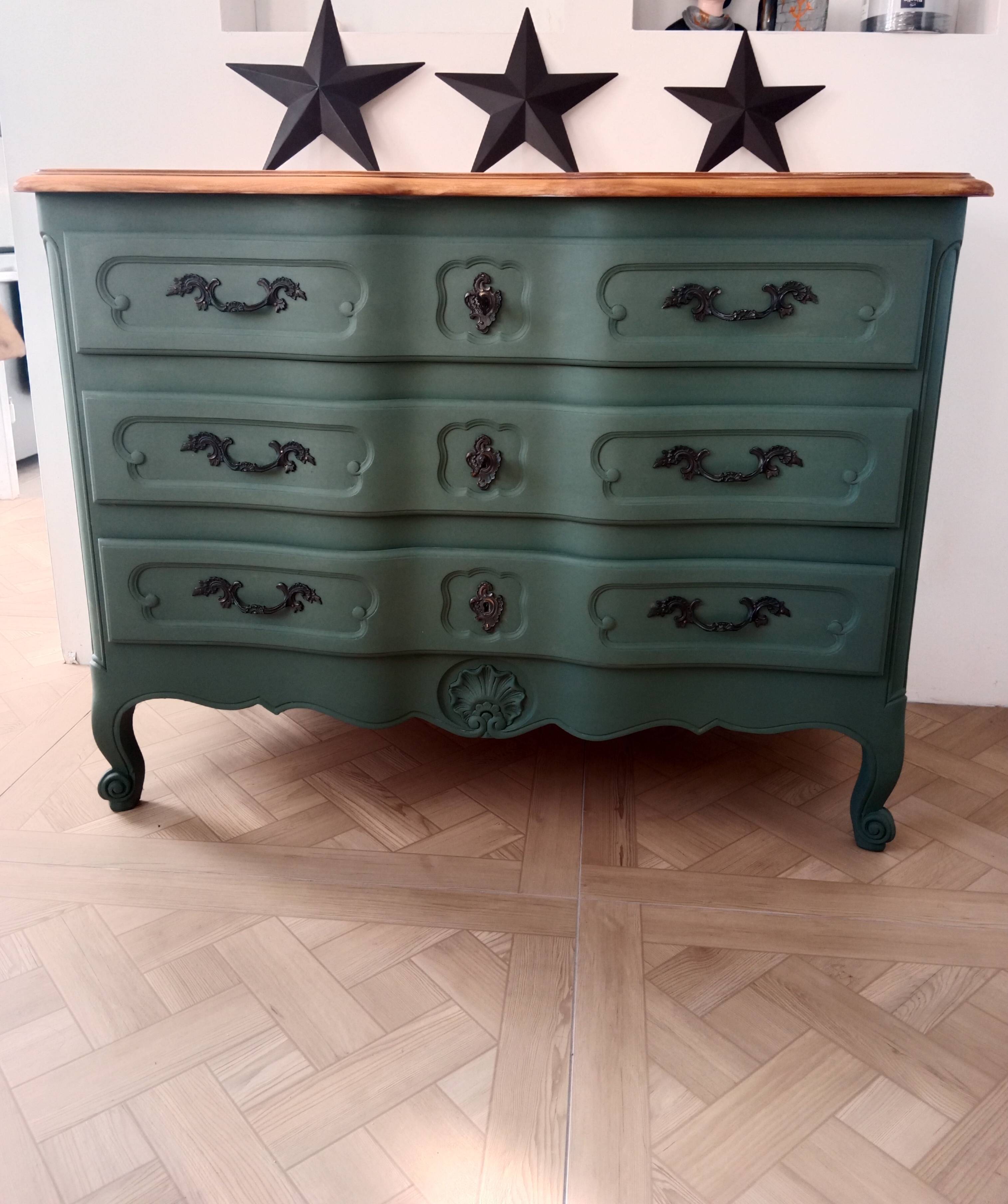Dark green patina crossbow chest of drawers