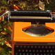 Silver reed orange and black typewriter with bag