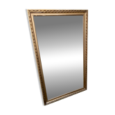 Grand miroir ancien glace biseautée bordée par un rang de perles 148 x 88