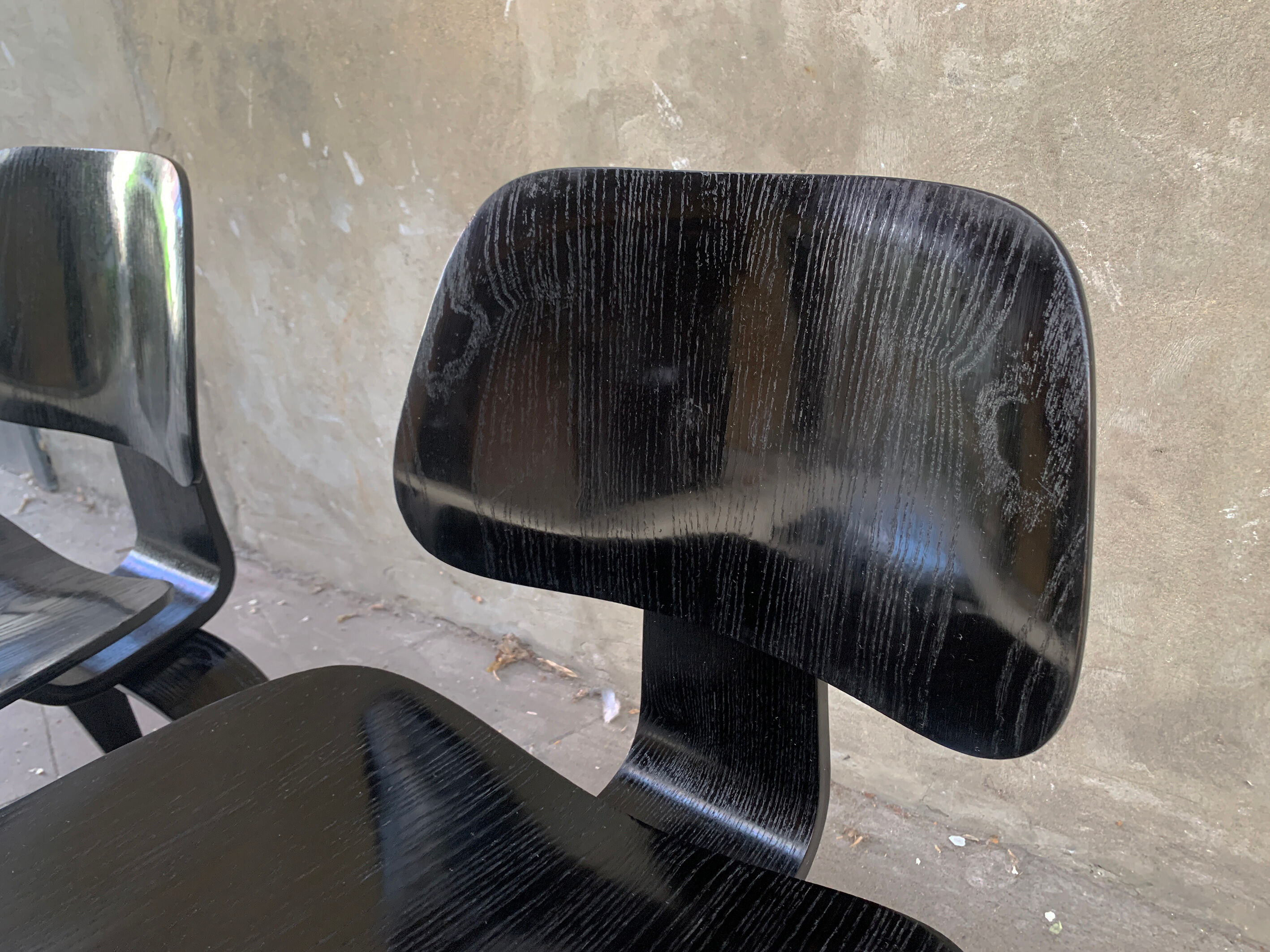 Pair of DCW chairs by Charles & Ray Eames in Black for Herman Miller 1950