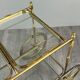 Rolling table cart in gilded brass with two glass shelves, 20th century.