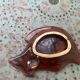 Empty pocket in glazed ceramic slip in the shape of vintage fish